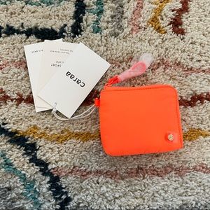 Brand new wallet by Caraa Sport! New with tags. Bright orange.